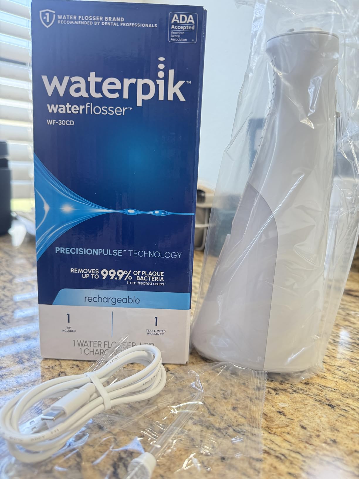 Waterpik Cordless 1100 Rechargeable Portable Water Flosser for Teeth Cleaning and Flossing, Travel, Braces Care, Healthier Gums, Waterproof for Shower, ADA Accepted, WF-30CD White, Packaging May Vary customer photo 1